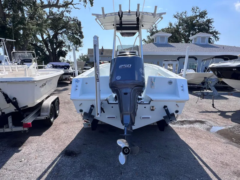Slide: The Image of Contender 21 Open boat with 2014 Yamaha 250 engine, rear view, parked outdoors. - 3