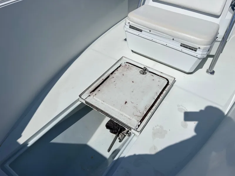 Slide: The Image of Contender 21 Open boat interior with storage compartment and seating, 2003 model. - 34