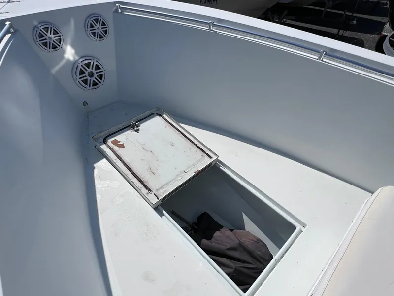 Slide: The Image of Open bow of 2003 Contender 21 with storage hatch and speakers. - 35