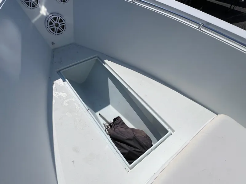 Slide: The Image of Open storage compartment on 2003 Contender 21 Open boat with speakers visible. - 36
