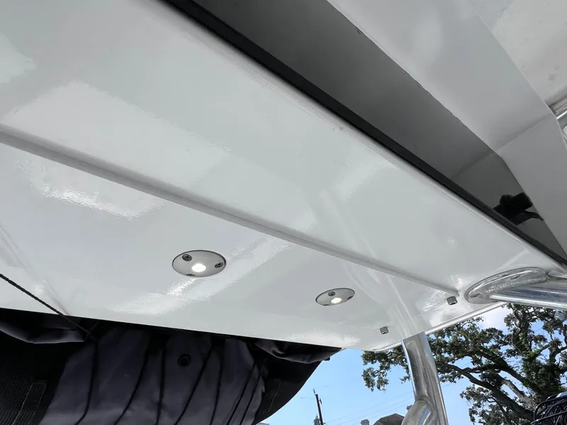 Slide: The Image of Contender 21 Open boat underside with lights, 2003 model, featuring 2014 Yamaha 250 engine. - 42