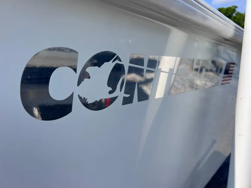 Slide: The Image of Contender 21 Open boat logo on hull, 2003 model with 2014 Yamaha 250 engine. - 47