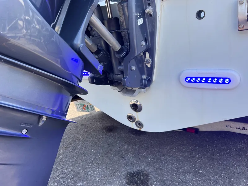 Slide: The Image of Contender 21 Open boat with 2014 Yamaha 250 engine, blue LED lights, close-up view. - 48