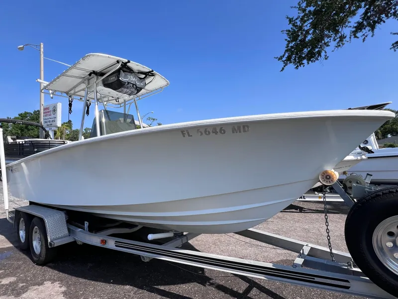 Slide: The Image of 2003 Contender 21 Open boat on trailer, featuring 2014 Yamaha 250 engine with 82 hours. - 5