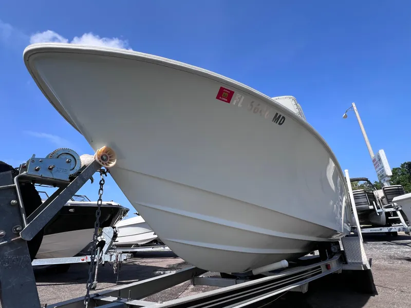 Slide: The Image of 2003 Contender 21 Open boat on trailer, featuring 2014 Yamaha 250 engine, 82 hours. - 7