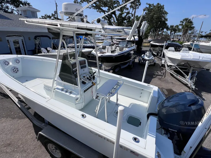 Slide: The Image of Contender 21 Open boat with 2014 Yamaha 250 engine, parked on trailer, sunny day. - 8