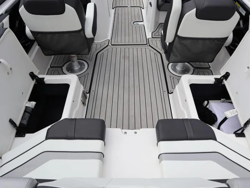 Slide: The Image of Interior of 2021 Yamaha Boats 212, featuring seating and storage compartments. - 11