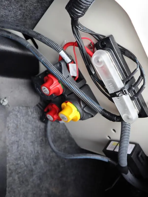Slide: The Image of Electrical wiring and switches inside a 2021 Yamaha Boats 212 model. - 12