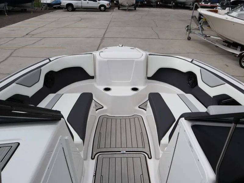 Slide: The Image of 2021 Yamaha Boats 212 interior with sleek seating and modern design. - 16