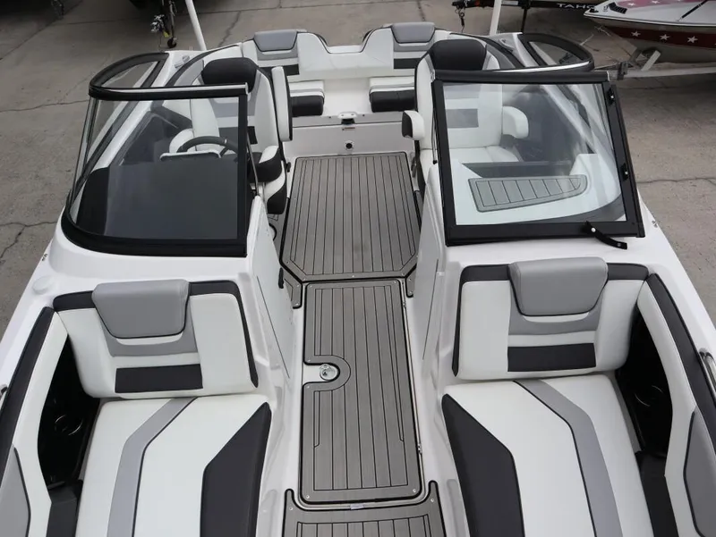 Slide: The Image of 2021 Yamaha Boats 212 interior, featuring sleek seating and modern design elements. - 21