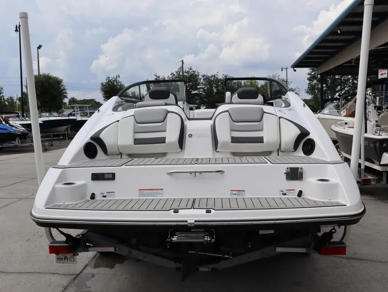 Slide: The Image of 2021 Yamaha Boats 212, rear view, showcasing sleek design and comfortable seating. - 6