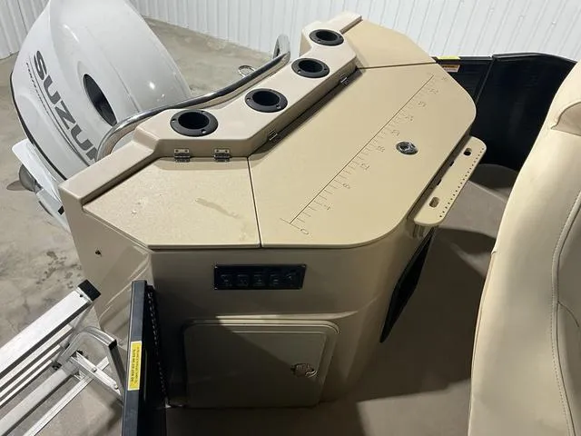 Slide: The Image of 2022 Godfrey Monaco 235 FS boat console with cup holders and Suzuki engine. - 14