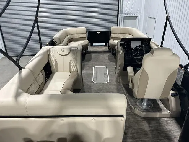 Slide: The Image of 2022 Godfrey Monaco 235 FS pontoon boat with beige seating and modern helm. - 15