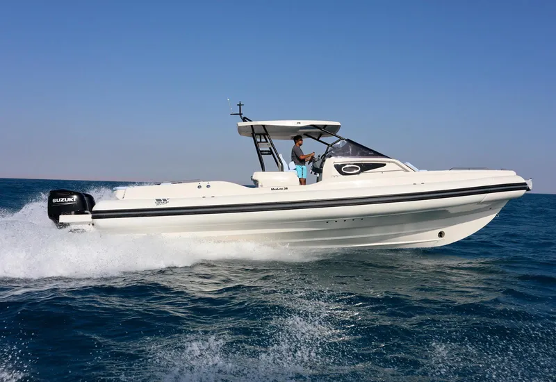Slide: The Image of 2026 Tiger Marine Maxline 38 cruising on open water, showcasing sleek design and powerful performance. - 3