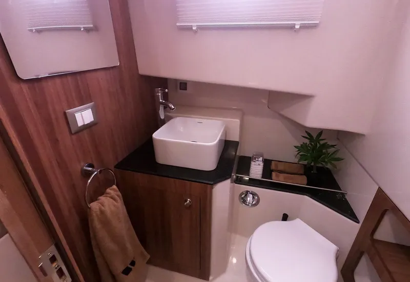 Slide: The Image of Modern bathroom in 2026 Tiger Marine Maxline 38 yacht, featuring sleek design and compact amenities. - 6