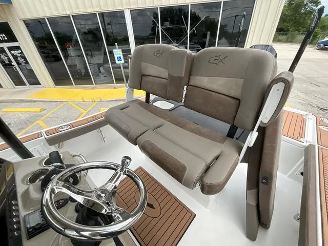 Slide: The Image of 2020 Crevalle 260HCO boat interior with dual seats and steering wheel. - 10