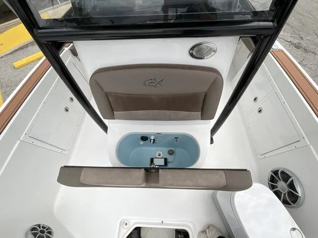 Slide: The Image of 2020 Crevalle 260HCO boat interior with seating and storage compartments. - 15