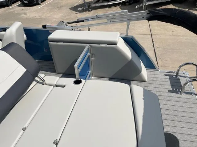 Slide: The Image of 2025 Starcraft EX20QDH boat interior with seating and storage compartments. - 14