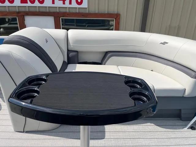 Slide: The Image of Luxurious 2025 Starcraft EX20QDH boat interior with plush seating and sleek table design. - 15