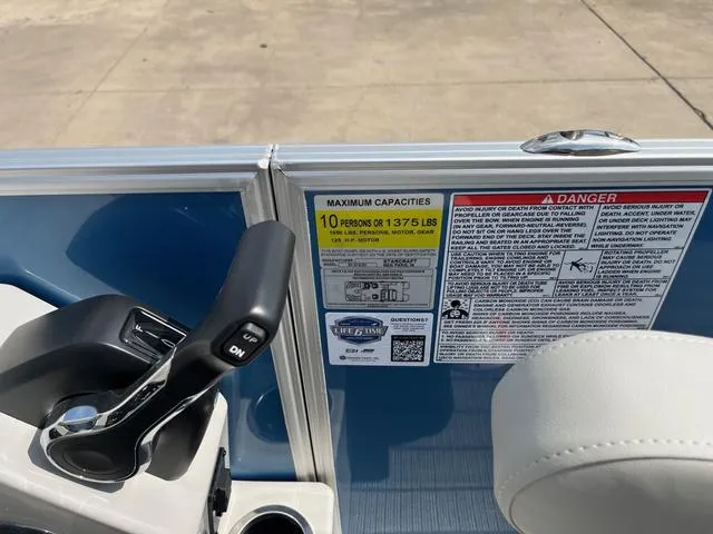 Slide: The Image of Control panel and capacity warning on 2025 Starcraft EX20QDH boat. - 26