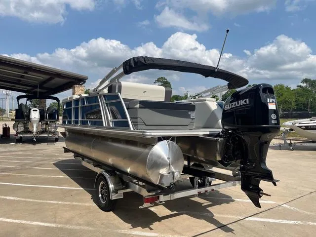 Slide: The Image of 2025 Starcraft EX20QDH pontoon boat with Suzuki outboard motor on trailer. - 6