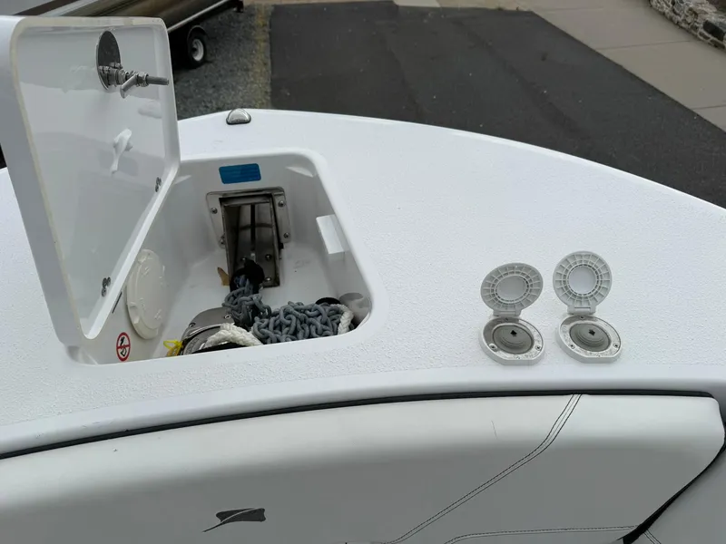 Slide: The Image of 2025 Stingray 273 CC boat deck with anchor storage and two circular fittings. - 30