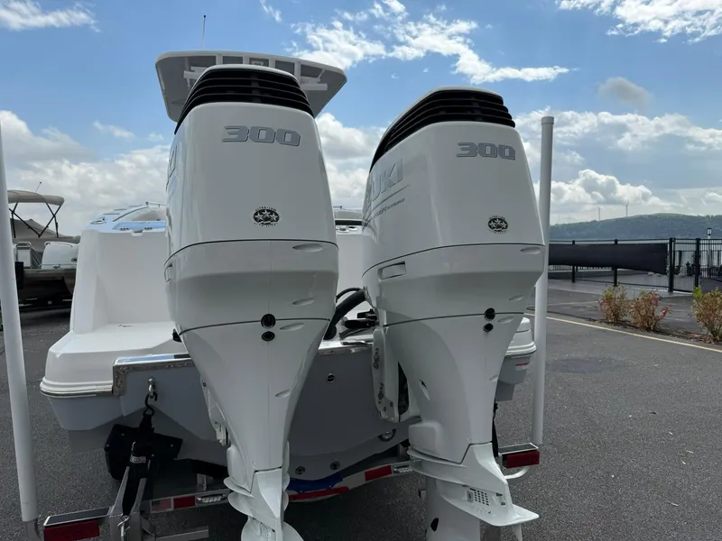Slide: The Image of 2025 Stingray 273 CC boat with dual 300 horsepower outboard engines. - 4