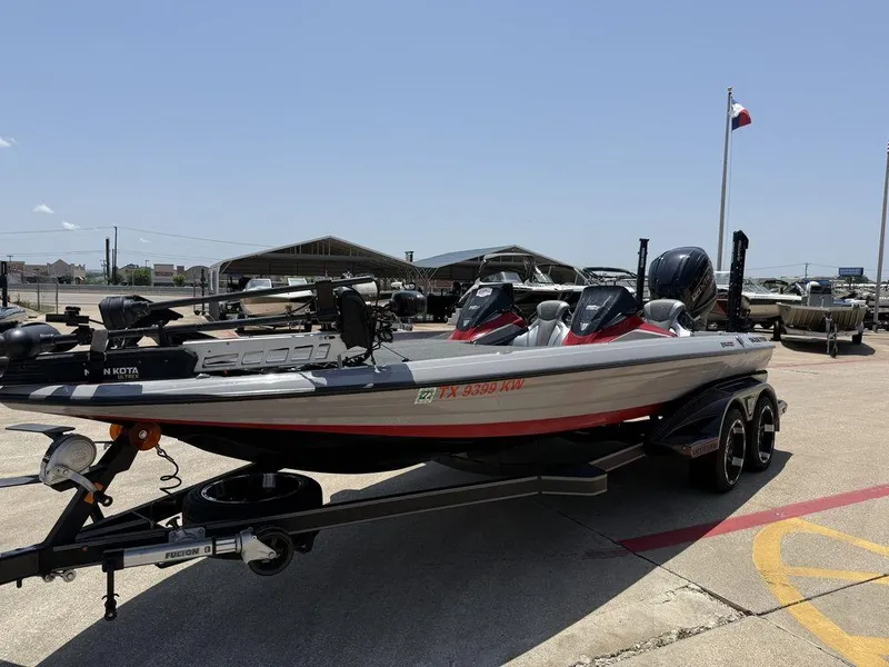 Slide: The Image of 2023 Skeeter FXR21 Limited boat on trailer at dealership, sunny day. - 3