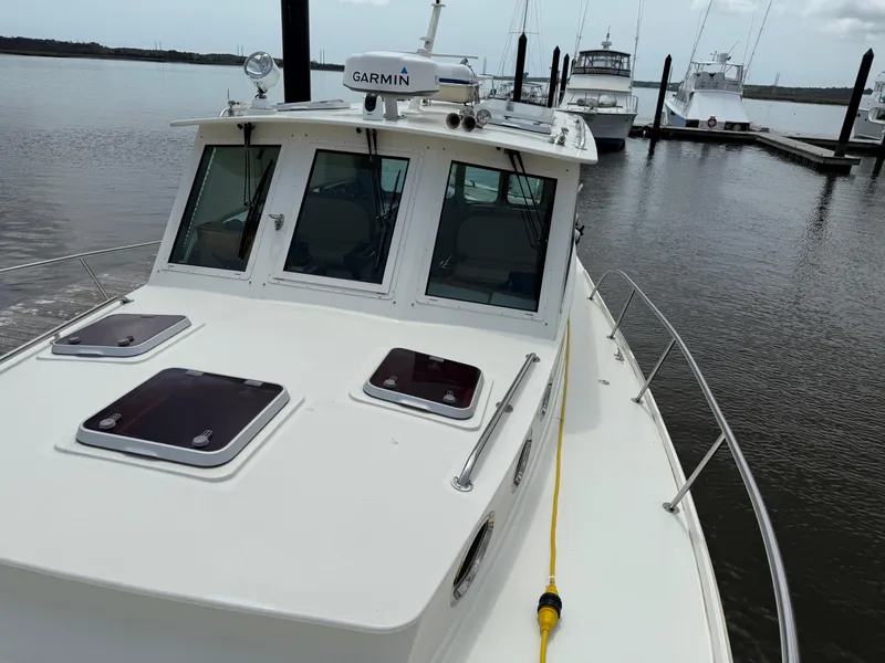 Slide: The Image of Mast & Mallet Thomas Point 40 boat, 2006 model, docked at marina with Garmin equipment. - 11