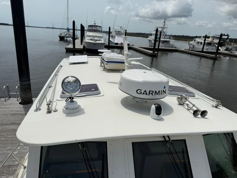 Slide: The Image of Mast & Mallet Thomas Point 40 boat docked, featuring Garmin equipment, 2006 model. - 13