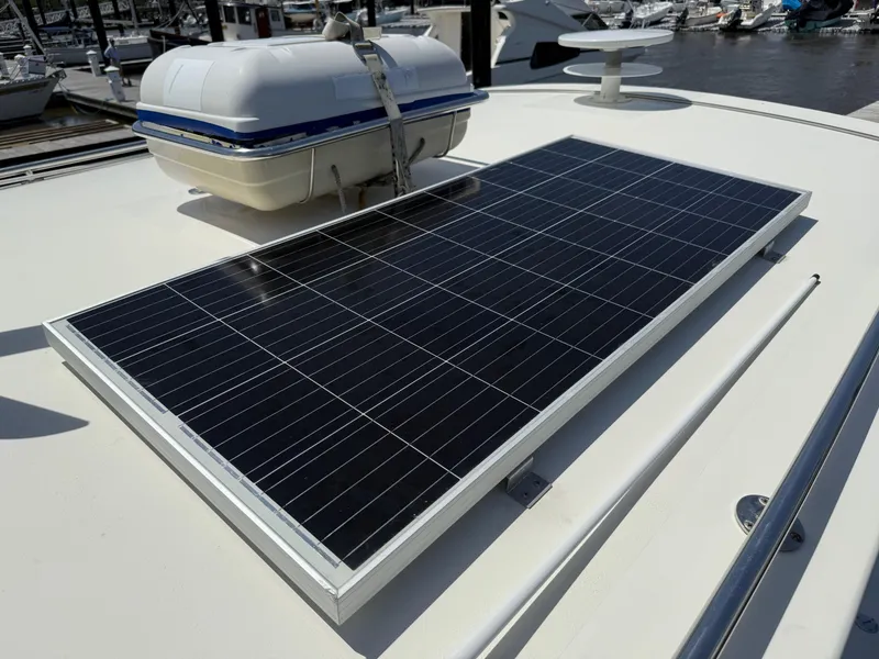 Slide: The Image of Solar panel on 2006 Mast & Mallet Thomas Point 40 boat deck, docked at marina. - 14