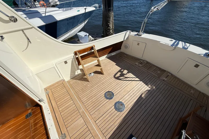 Slide: The Image of Spacious deck of 2006 Mast & Mallet Thomas Point 40 boat, featuring wooden flooring. - 17