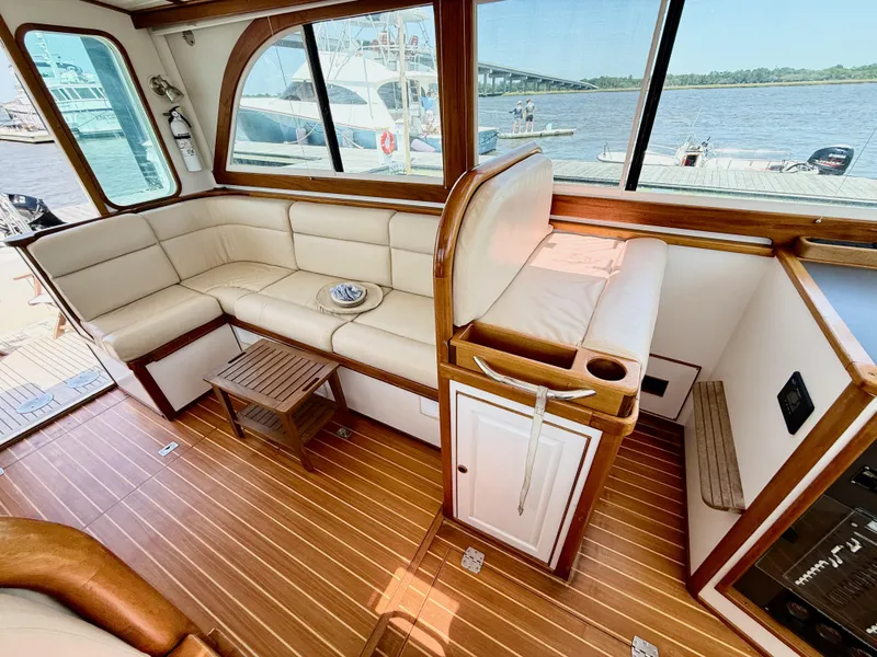 Slide: The Image of Luxurious interior of 2006 Mast & Mallet Thomas Point 40 yacht with leather seating and wood finish. - 21