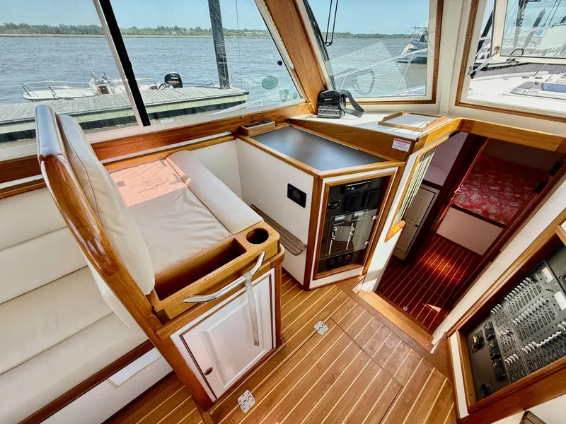 Slide: The Image of Interior of 2006 Mast & Mallet Thomas Point 40 boat with wood accents and seating. - 24