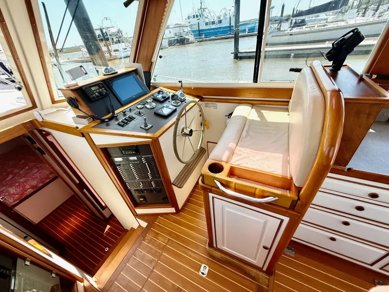 Slide: The Image of Helm of 2006 Mast & Mallet Thomas Point 40 boat, featuring navigation equipment and wooden interior. - 25