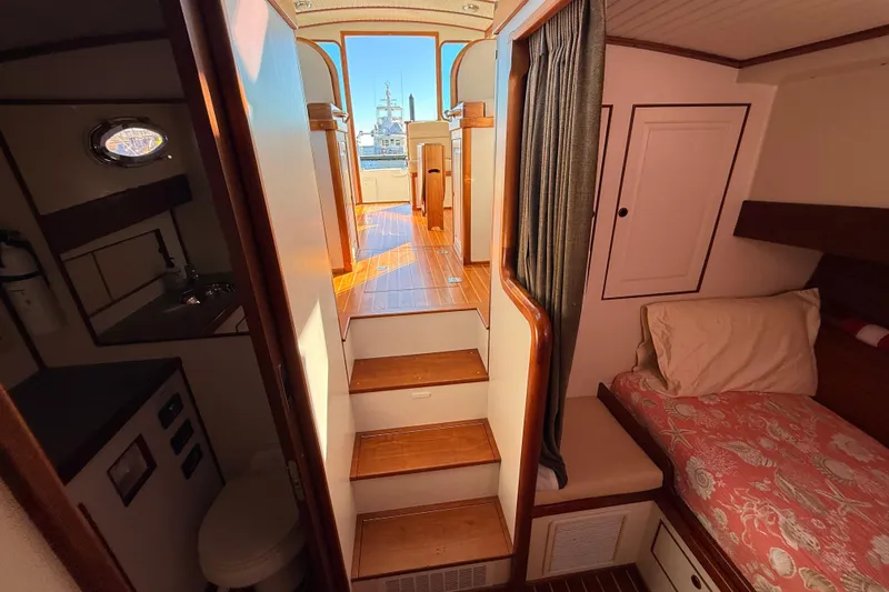 Slide: The Image of Interior of 2006 Mast & Mallet Thomas Point 40 boat, featuring cozy cabin and wooden stairs. - 35