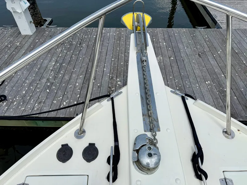 Slide: The Image of Bow of 2006 Mast & Mallet Thomas Point 40 boat with anchor chain and dock view. - 9