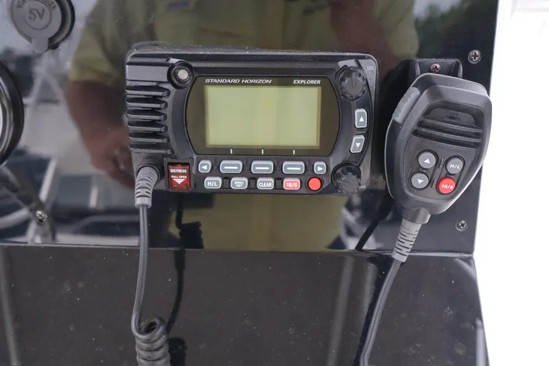 Slide: The Image of Standard Horizon Explorer marine radio on 2004 Edgewater 225CC boat dashboard. - 10