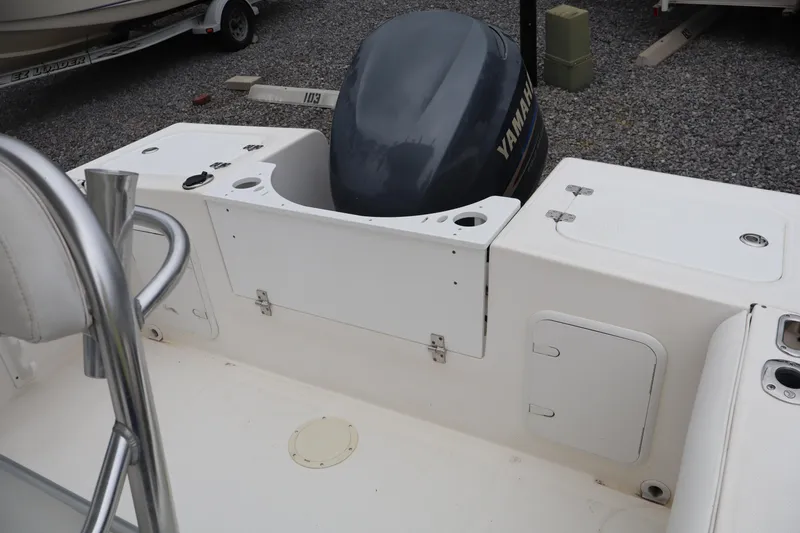 Slide: The Image of 2004 Edgewater 225CC boat with Yamaha outboard motor, featuring a spacious deck layout. - 17