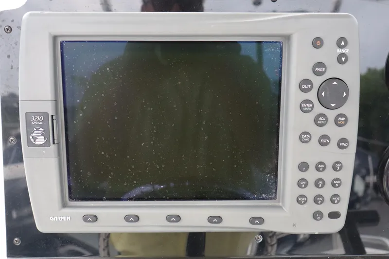 Slide: The Image of Garmin marine GPS device on 2004 Edgewater 225CC boat dashboard. - 8