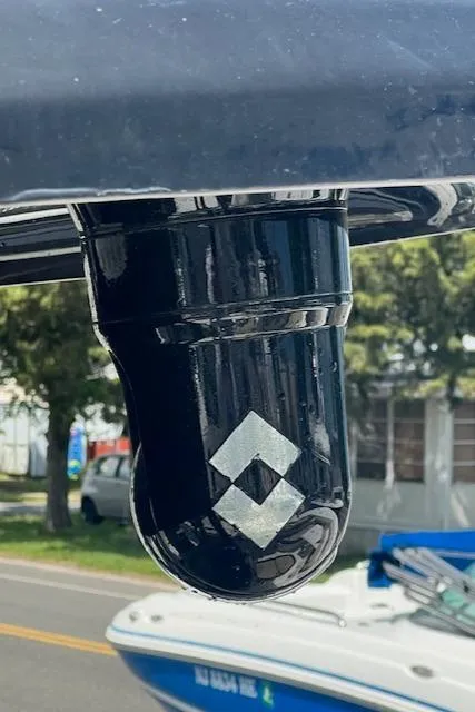 Slide: The Image of Close-up of a 2020 Tidewater 272 CC Adventure boat component with a geometric logo. - 11