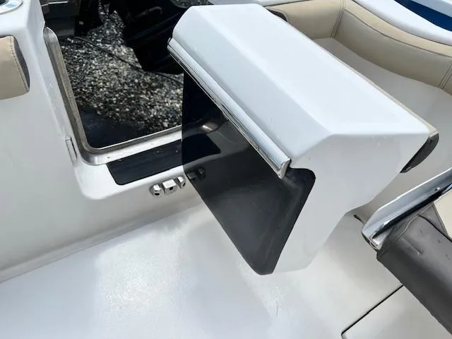 Slide: The Image of 2020 Tidewater 272 CC Adventure boat interior detail, featuring a sleek white and black compartment. - 12