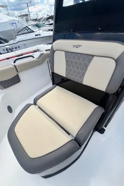 Slide: The Image of 2020 Tidewater 272 CC Adventure boat seat with beige and gray upholstery. - 19