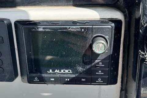Slide: The Image of JL Audio system on 2020 Tidewater 272 CC Adventure boat dashboard. - 9