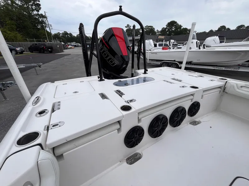 Slide: The Image of 2021 Tidewater 2500 Carolina Bay boat with powerful outboard motor and spacious deck. - 5
