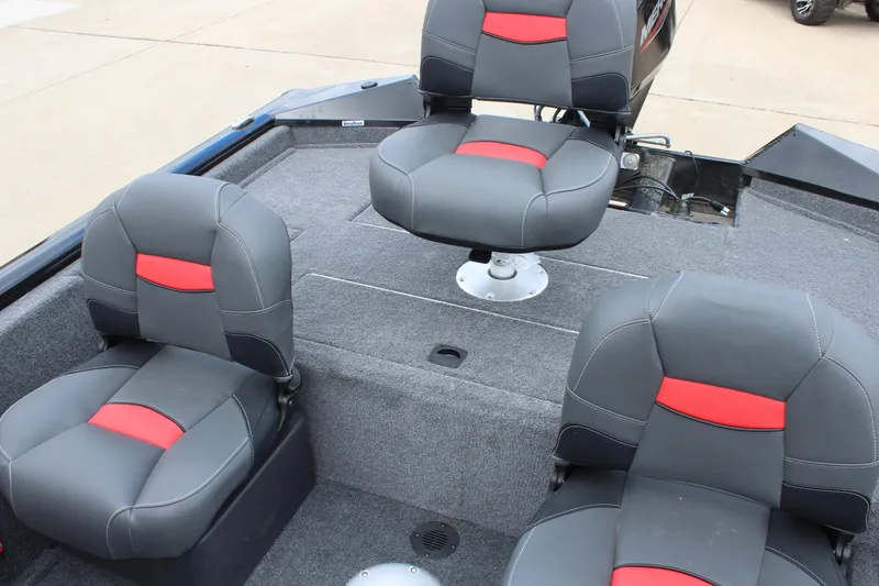 Slide: The Image of 2025 Tracker Pro Team 175 Crappie Edition boat interior with gray and red seating. - 12