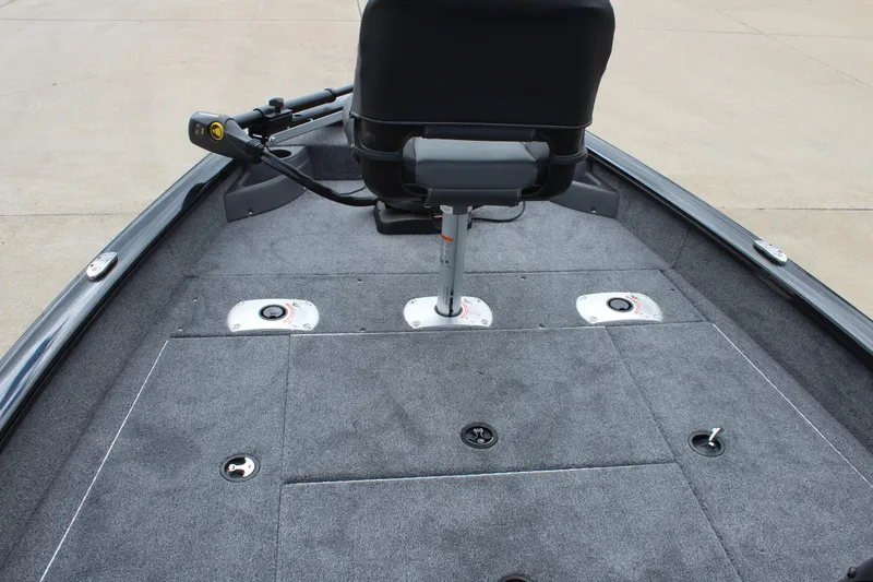 Slide: The Image of 2025 Tracker Pro Team 175 Crappie Edition boat deck with seating and storage compartments. - 13