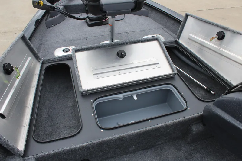 Slide: The Image of 2025 Tracker Pro Team 175 Crappie Edition boat with open storage compartments. - 14