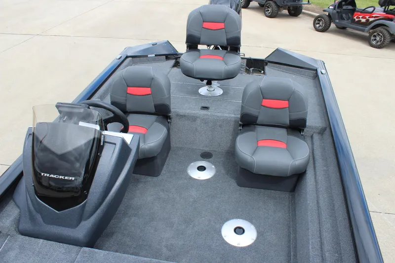 Slide: The Image of 2025 Tracker Pro Team 175 Crappie Edition boat interior with four seats and steering console. - 17