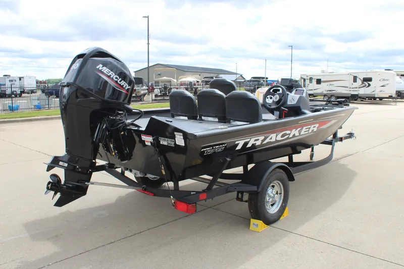 Slide: The Image of 2025 Tracker Pro Team 175 Crappie Edition boat with Mercury engine on trailer. - 3